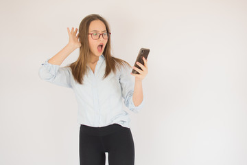 Fototapeta premium Beautiful young girl with glasses and mobile