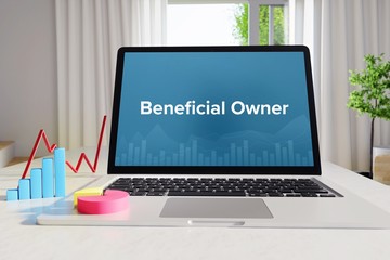 Beneficial Owner – Statistics/Business. Laptop in the office with term on the Screen. Finance/Economy.