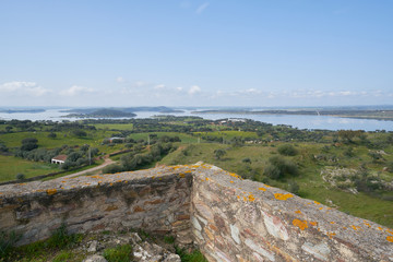 Fototapeta na wymiar Lake water reservoir of Alqueva Dam landscape from Mourao castle in Alentejo, Portugal