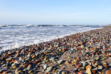 rocky Baltic Sea beach with beautiful colored pebbles