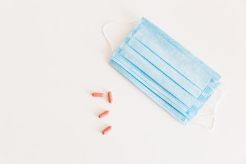 Disposable medical face mask. Prevention of the Covid-19 pandemic virus. Antiviral medical mask for protection from flu diseases. Medical respiratory and tablets