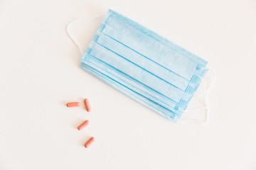 Disposable medical face mask. Prevention of the Covid-19 pandemic virus. Antiviral medical mask for protection from flu diseases. Medical respiratory and tablets