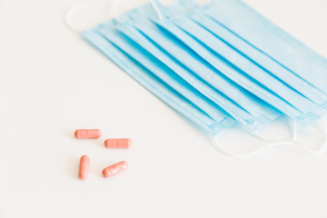 Disposable medical face mask. Prevention of the Covid-19 pandemic virus. Antiviral medical mask for protection from flu diseases. Medical respiratory and tablets