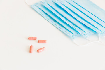 Disposable medical face mask. Prevention of the Covid-19 pandemic virus. Antiviral medical mask for protection from flu diseases. Medical respiratory and tablets