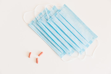 Disposable medical face mask. Prevention of the Covid-19 pandemic virus. Antiviral medical mask for protection from flu diseases. Medical respiratory and tablets