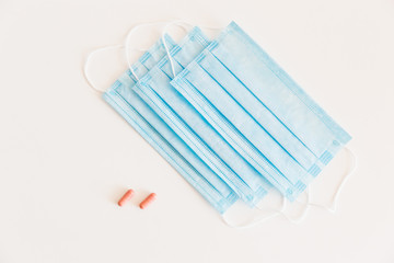 Disposable medical face mask. Prevention of the Covid-19 pandemic virus. Antiviral medical mask for protection from flu diseases. Medical respiratory and tablets