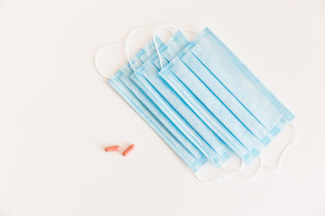 Disposable medical face mask. Prevention of the Covid-19 pandemic virus. Antiviral medical mask for protection from flu diseases. Medical respiratory and tablets