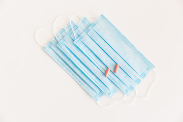 Disposable medical face mask. Prevention of the Covid-19 pandemic virus. Antiviral medical mask for protection from flu diseases. Medical respiratory and tablets