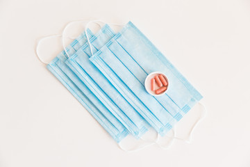 Disposable medical face mask. Prevention of the Covid-19 pandemic virus. Antiviral medical mask for protection from flu diseases. Medical respiratory and tablets