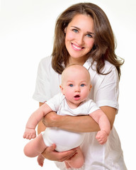Mother and baby playing and smiling. Happy family.