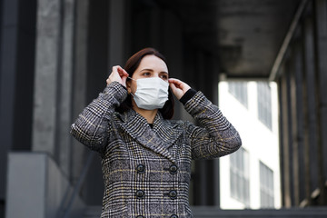 Girl in a medical mask. Stay at home. Pandemic coronavirus. COVID-19. SARS-CoV-2. 2019-nCoV
