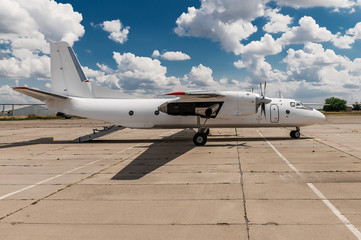 Exterior of AN-26 cargo aircraft parked at the airport