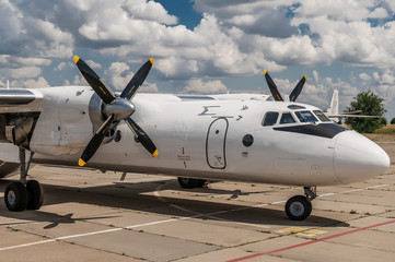 Exterior of AN-26 cargo aircraft parked at the airport