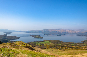 Fototapeta na wymiar View from Conic hill in Scotland. Beautiful mountains with lake.