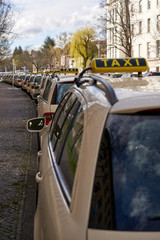 Berlin Germany, Line of yellow taxi cabs parking in a street in inner city of berlin. no passengers...
