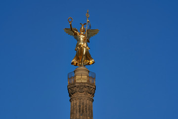 Fototapeta na wymiar close-up of the Goldelse, the Statue of St. Victoria on the Victory Column, Tiergarten, Berlin city, Germany on a sunny day with a beautiful blue sky