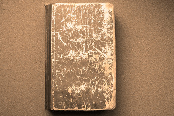 the book is old with traces of existence, decrepitude. An item from the past.