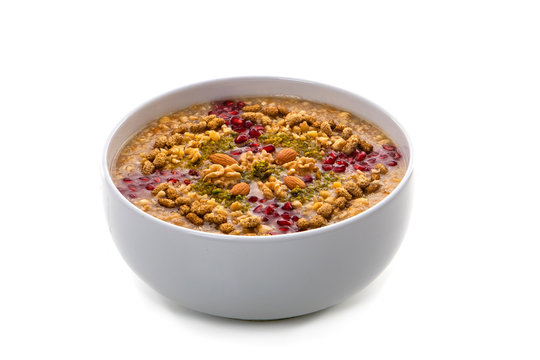 Traditional Turkish Dessert Asure - Ashura on white background. Also known as Noah's pudding.
