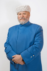 Mature man with a gray beard in a hat