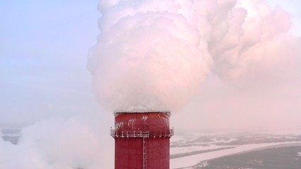 Aerial view. Emission to atmosphere from industrial pipes. Smokestack pipes shooted with drone