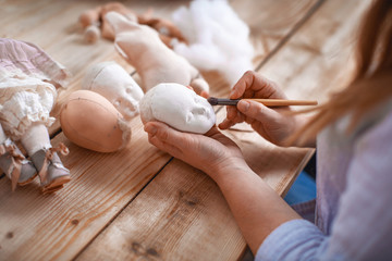 Workflow, masters of making handmade dolls. Shaping the doll's face.