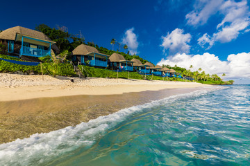 Lalomanu beach with open huts called fales, south side of Upolu Island, Samoa