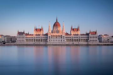 Fototapeta na wymiar The Hungarian Parliament Building on the bank of the Danube at the sunset in Budapest