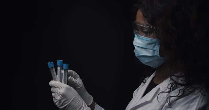 Virologist tests the virus in test tubes