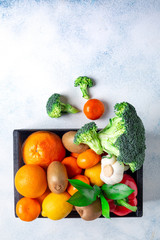 A variety of products, vegetables and fruits to maintain immunity in a black box on a white background. Copy space