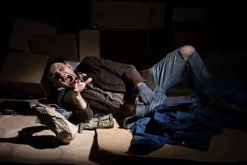 A middle-aged homeless man became alcoholic because of his situation.