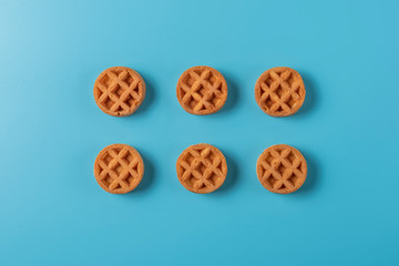 Soft Viennese waffles on a blue background	