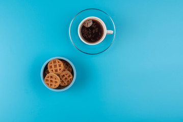 Obraz na płótnie Canvas Soft Viennese waffles on a blue background 