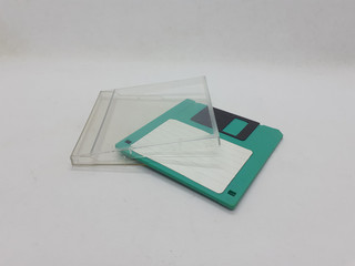 Vintage Photo Realistic Small Electronic Magnetic Floppy Disk for Old Computer Data Storage in White Isolated Background