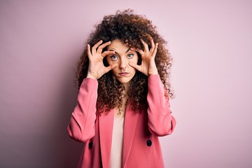 Young beautiful businesswoman with curly hair and piercing wearing elegant jacket Trying to open...