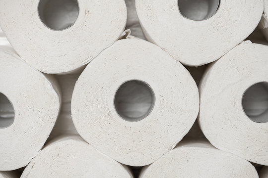 Toilet paper rools stacked on top of each other