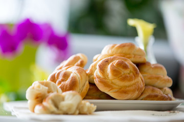 Bread buns in a plate on a table