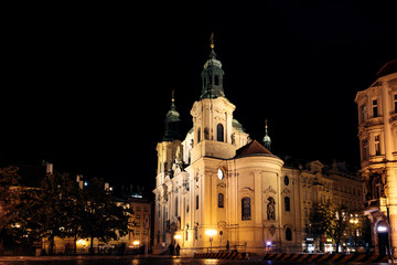 View of St Nicholas' Church in the Old Square of Prague, lit up at night