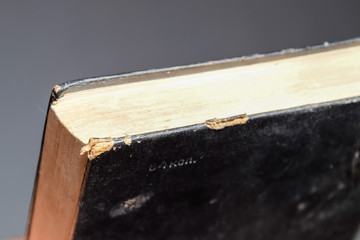 binding of an old book in black cover.