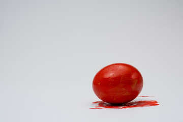 red egg on a white background