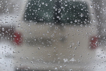 raindrops on the window glass in cloudy weather 
