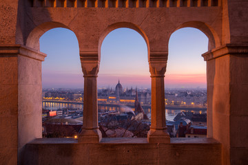 Beautiful view from the Fisherman's Bastion on the Hungarian Parliament at the winter sunrise,...