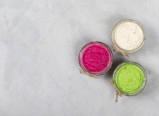 Russian appetizer horseradish with beetroot, green horseradish wasabi, white horseradish with lemon on a white background top view