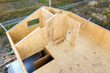 Construction of new and modern modular house. Walls made from composite wooden sip panels with...