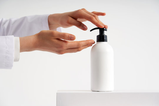 Woman Hands Pushing Pump Plastic Soap Bottle With Copy Space, Using Wash Hand Sanitizer Gel Pump Dispenser. Killing Germs, Bacteria And Virus