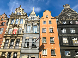 Fototapeta na wymiar Gdansk, Poland - 21/ 06/ 2019:. Beautiful multi-colored houses in the old town in Gdansk. The central streets of the historic center of Gdansk. The main tourist attraction of Gdansk. 