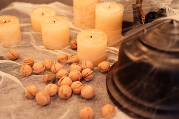 Black teapot with nuts and candles in spider halloween