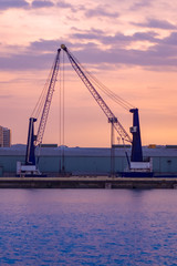 Fototapeta premium watching dusk in the port of la coruña while their cranes rest