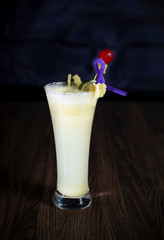 A glass Of Pineapple juice with Cherry 