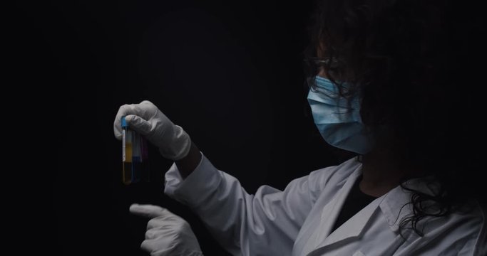 Scientist checks reagents during an experiment.