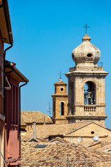 Fototapeta na wymiar Selective focus of the bell towers of the Collegiate Church of Santo Stefano and the Convent of San Francesco in Castelfidardo, Ancona Province, Marche Region, Italy
